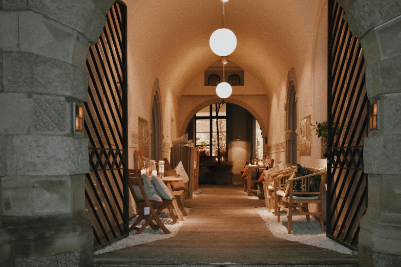 a building with wooden furniture and lighting