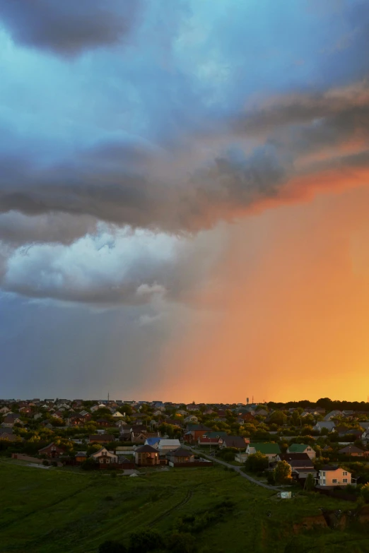 an image of a dark cloud rolling over a small town