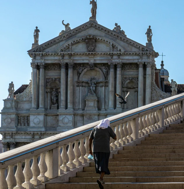 a woman that is on top of steps