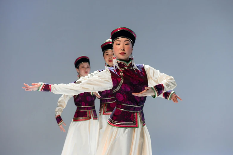an asian folk ensemble performing on stage