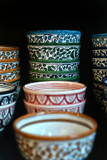 many bowls and bowls that have designs on them