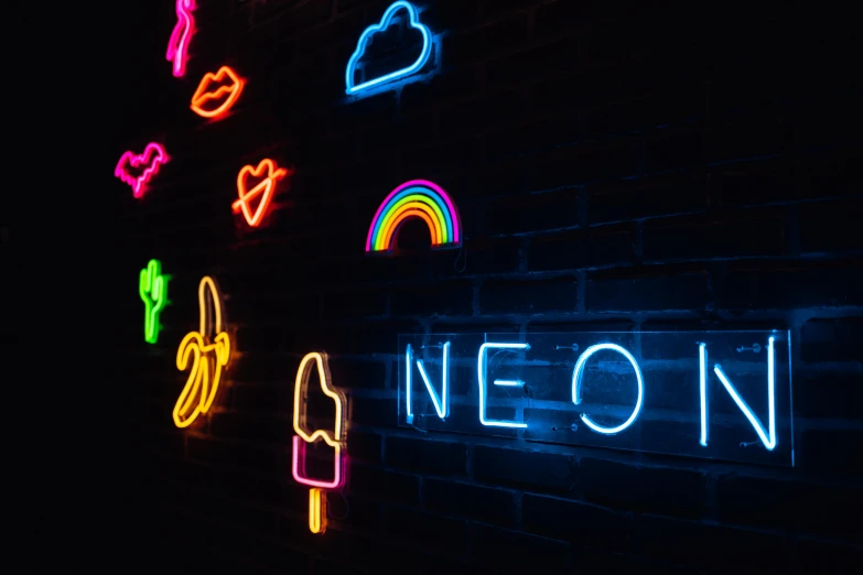 neon light up on the brick wall, displaying different symbols