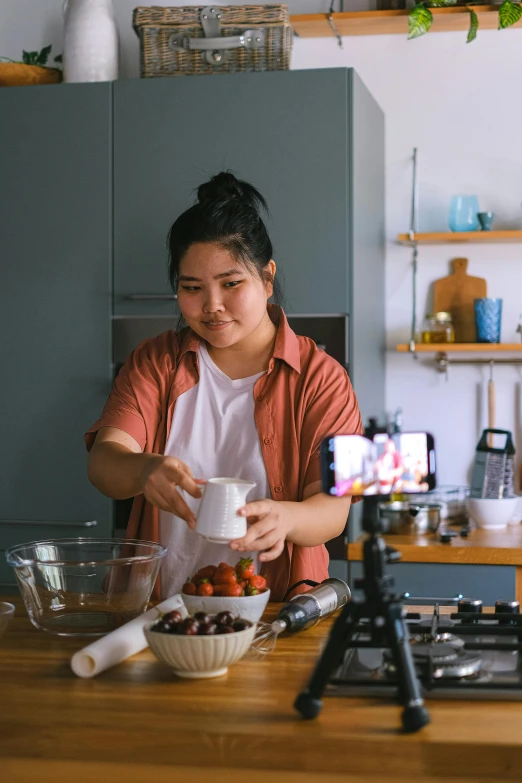 a woman that is standing up at a counter