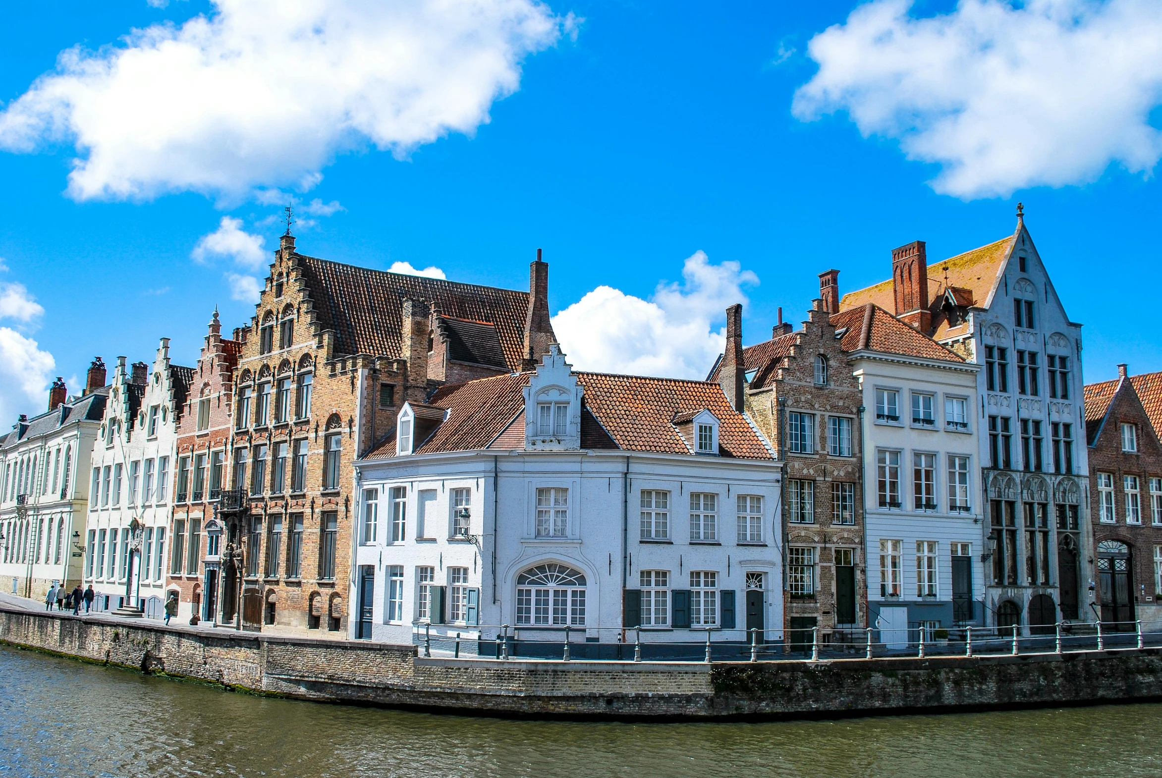 a row of buildings next to the water