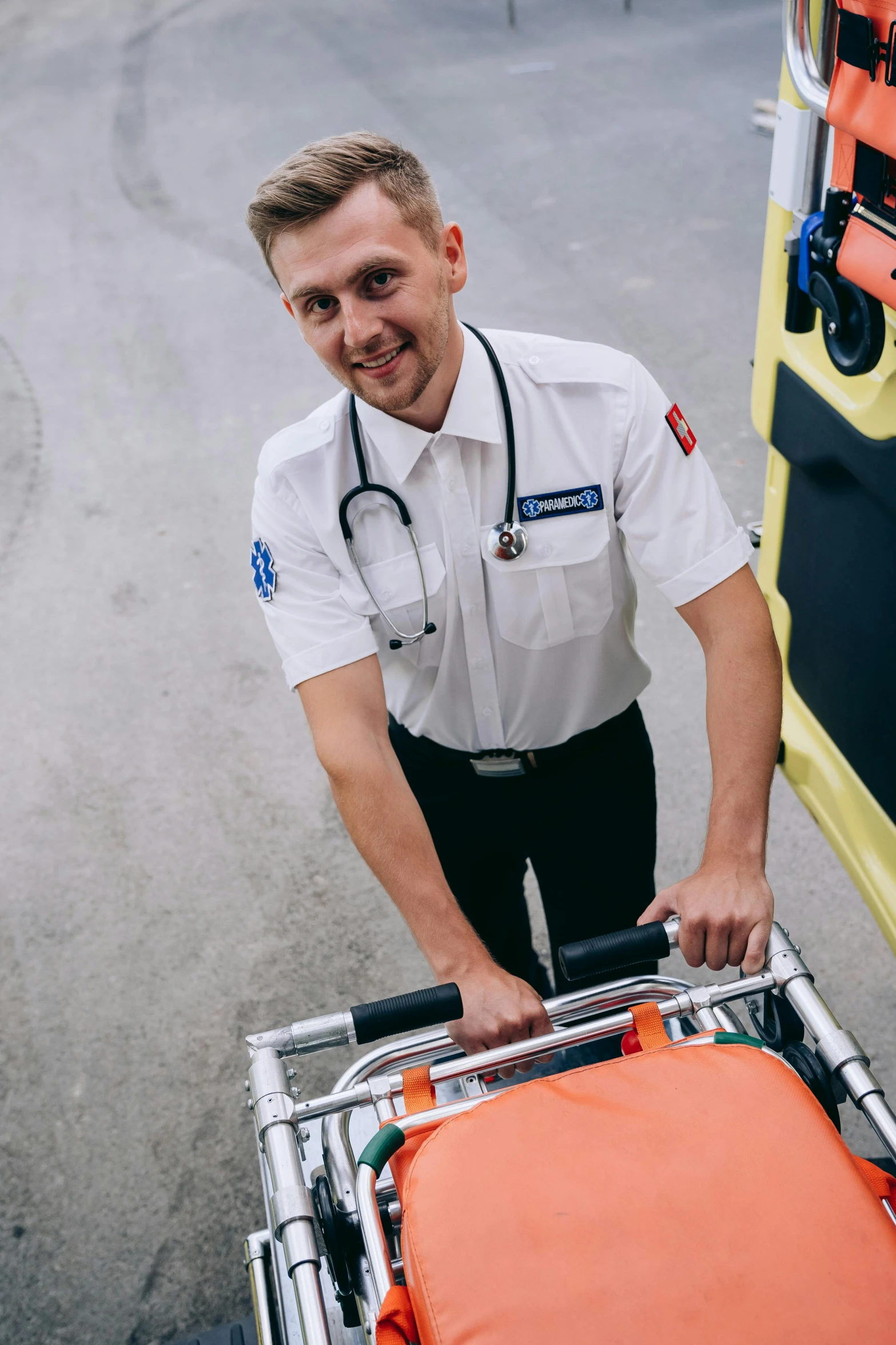 a man in uniform with a trolley standing next to him