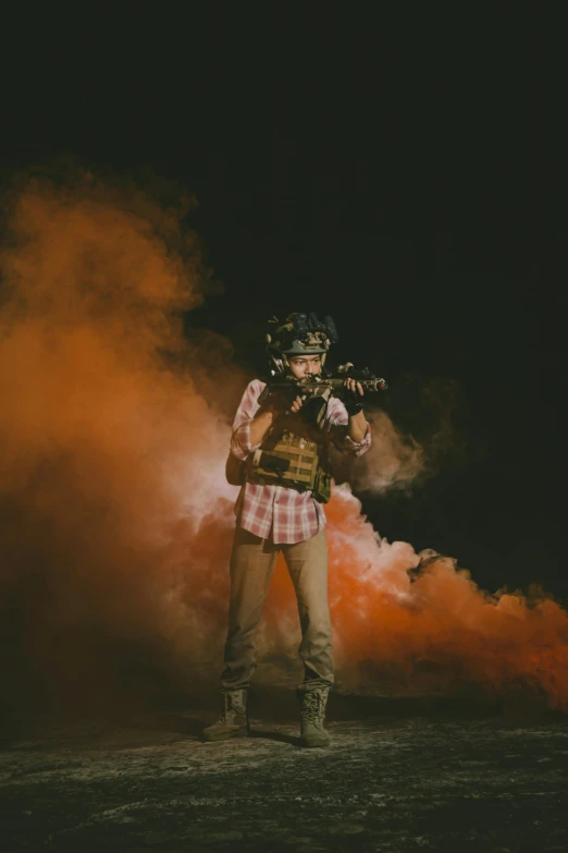 a man wearing a helmet holding a camera in the air