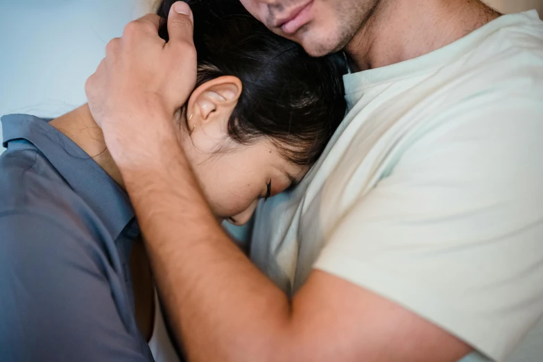 a young man hugging an old lady on the side