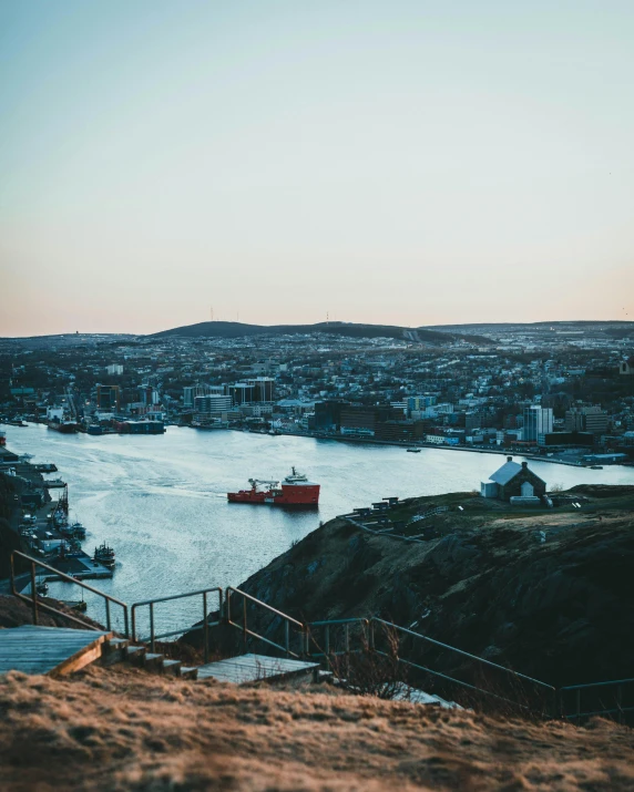 the view from the top of a cliff looking out over a city