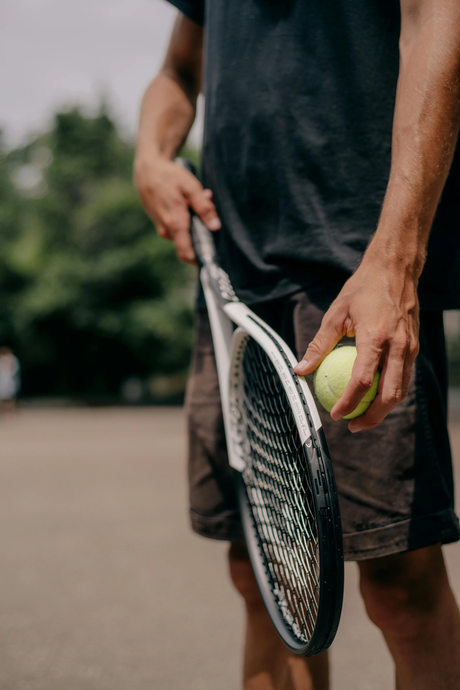 a tennis player holding his racket and ball