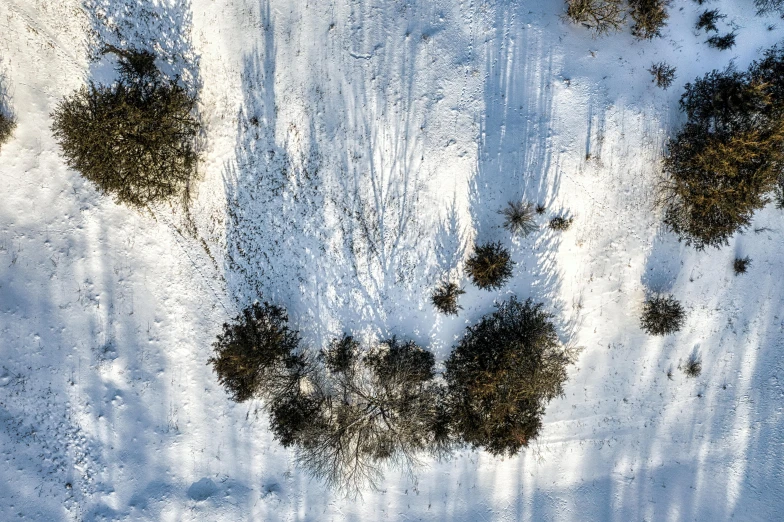 an aerial view of a snow covered landscape