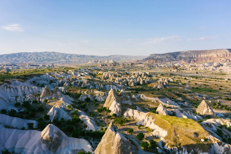 a mountainous valley with rock formations is shown