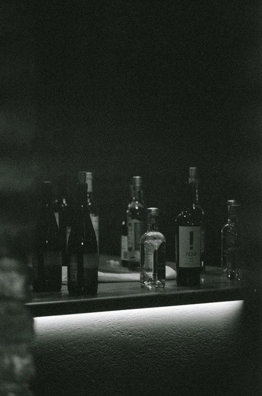 a close - up of alcohol bottles sitting on a counter