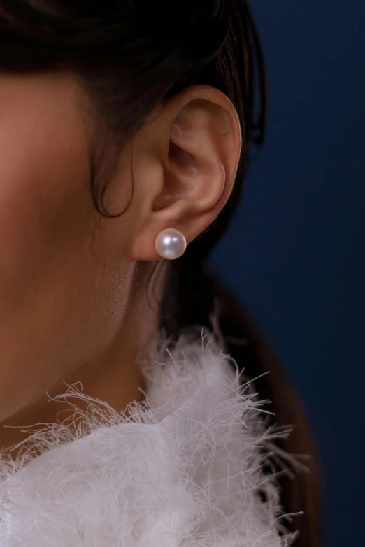 the earrings are decorated with small pearls