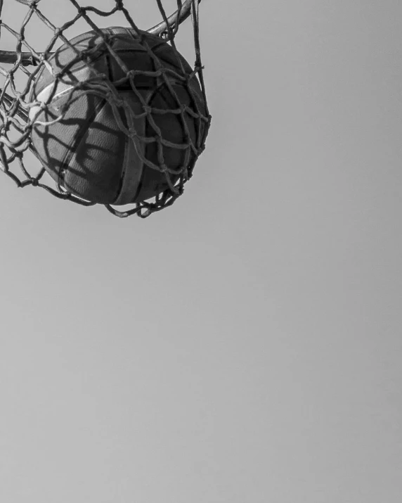 an empty basketball hoop with the net pulled up