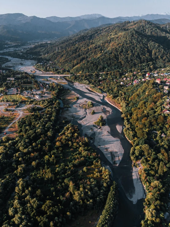 an aerial view shows mountains and a river