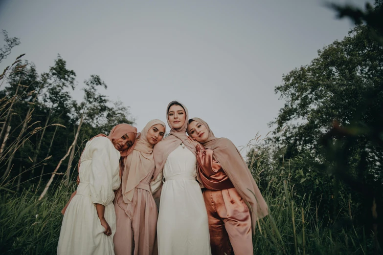 three women dressed in pink standing beside each other