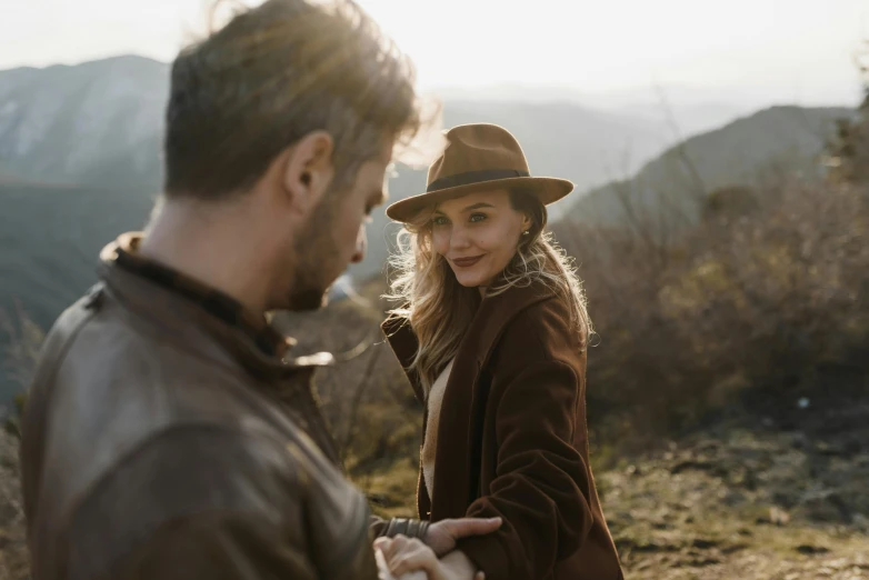 a man and woman are standing near each other