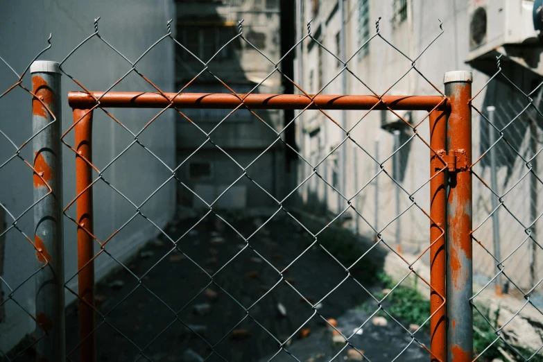 a fence and sidewalk next to each other