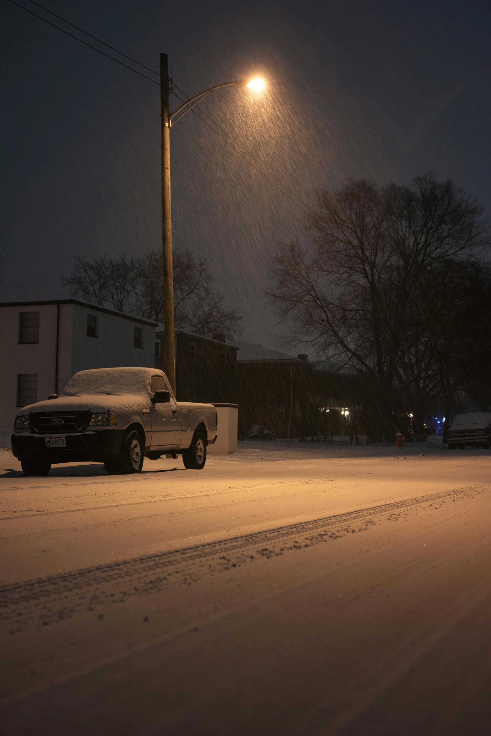 a car parked on the side of the road in the snow