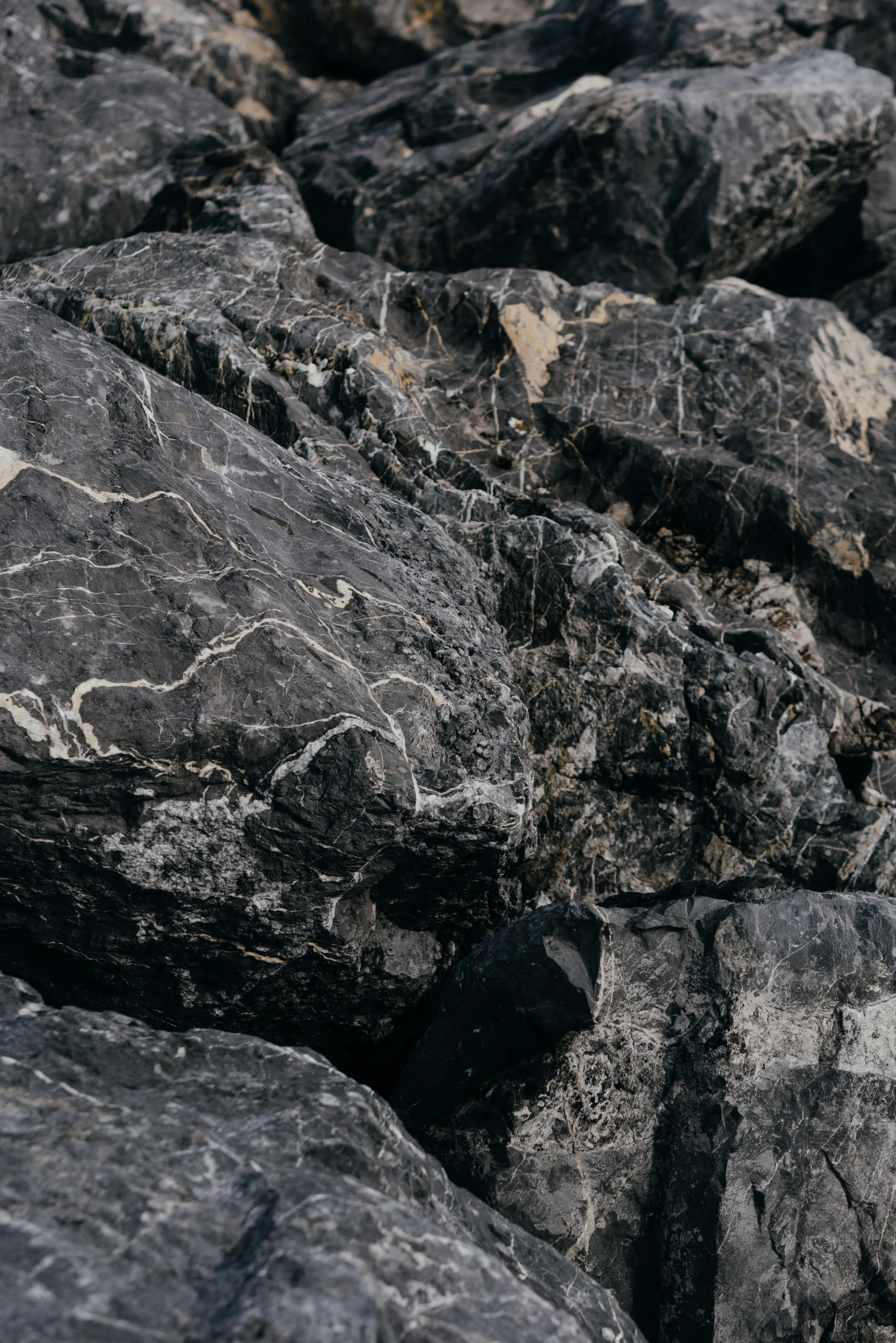 black rocks that have been set together in a pile