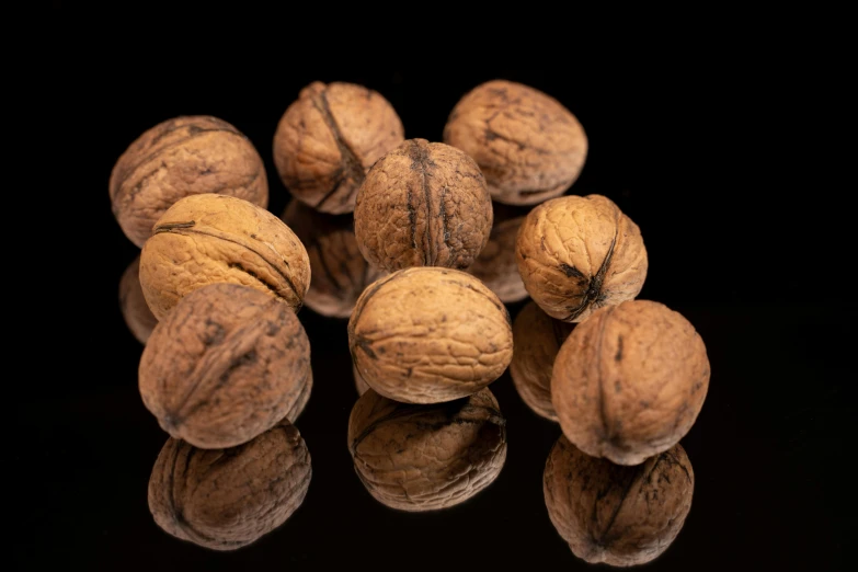 a bunch of nuts sit together on a table