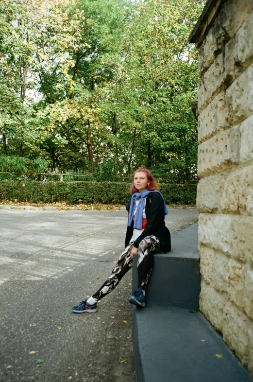 a woman sitting on the edge of stairs