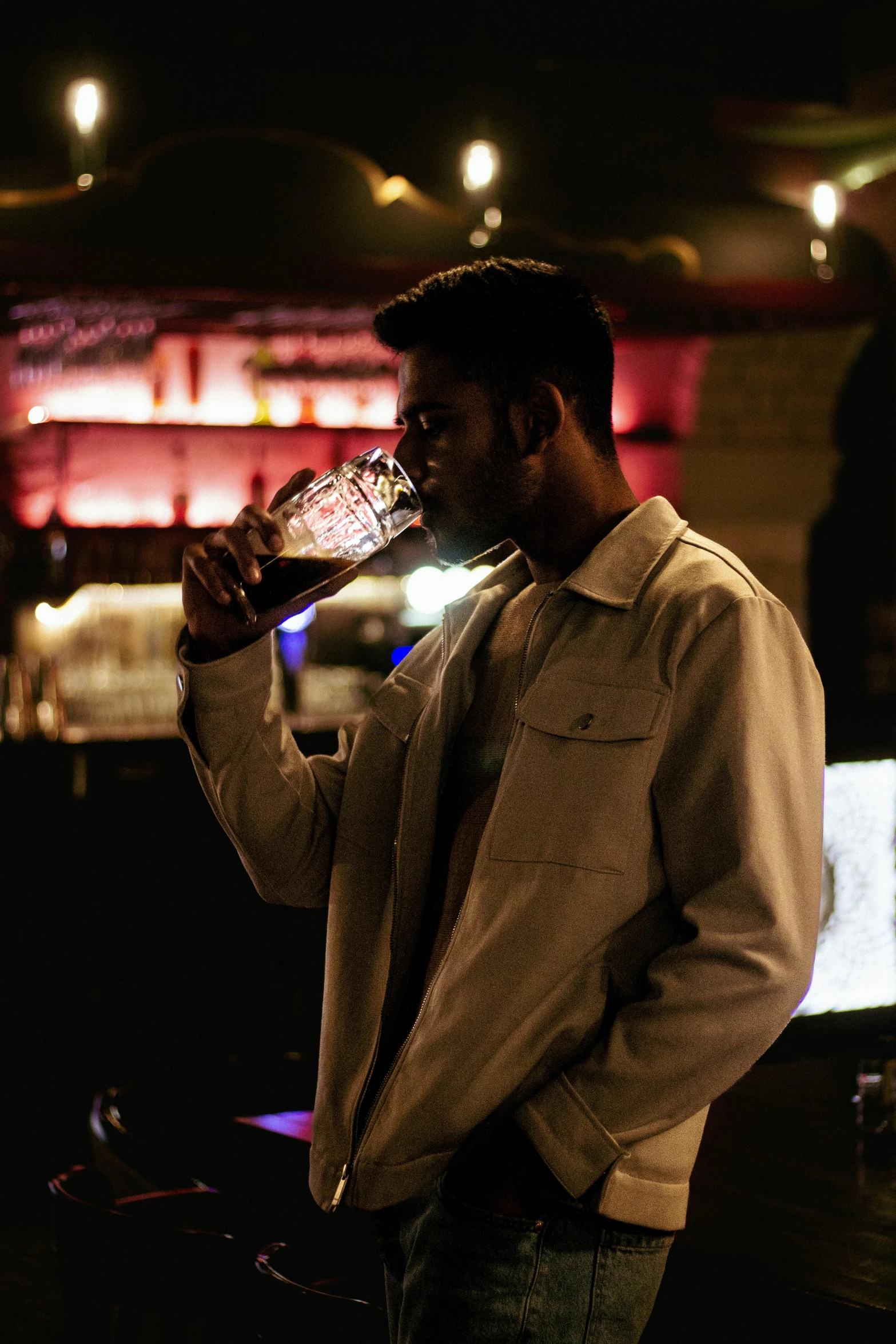 a man drinks water from his bottle