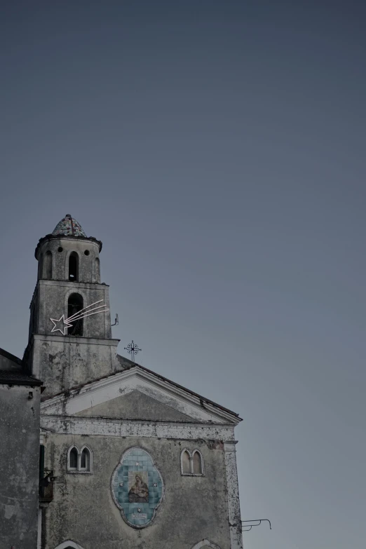 the back side of a church with a clock