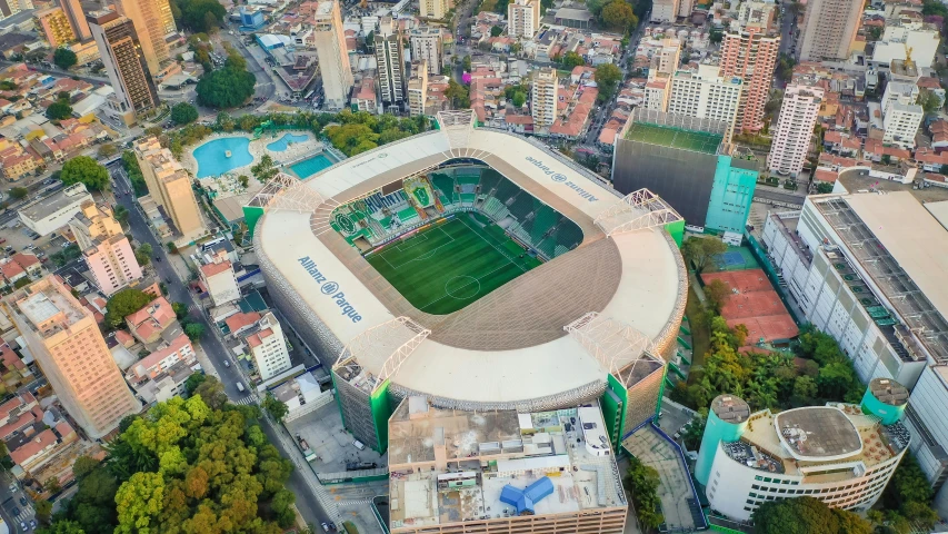 an aerial view of a stadium surrounded by buildings