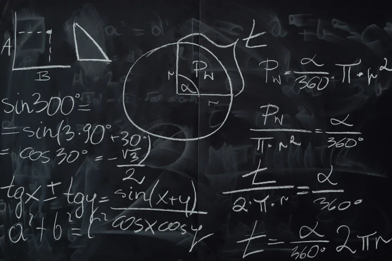 a blackboard with several calculations written on it
