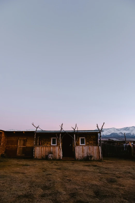 a small shack that is on the field