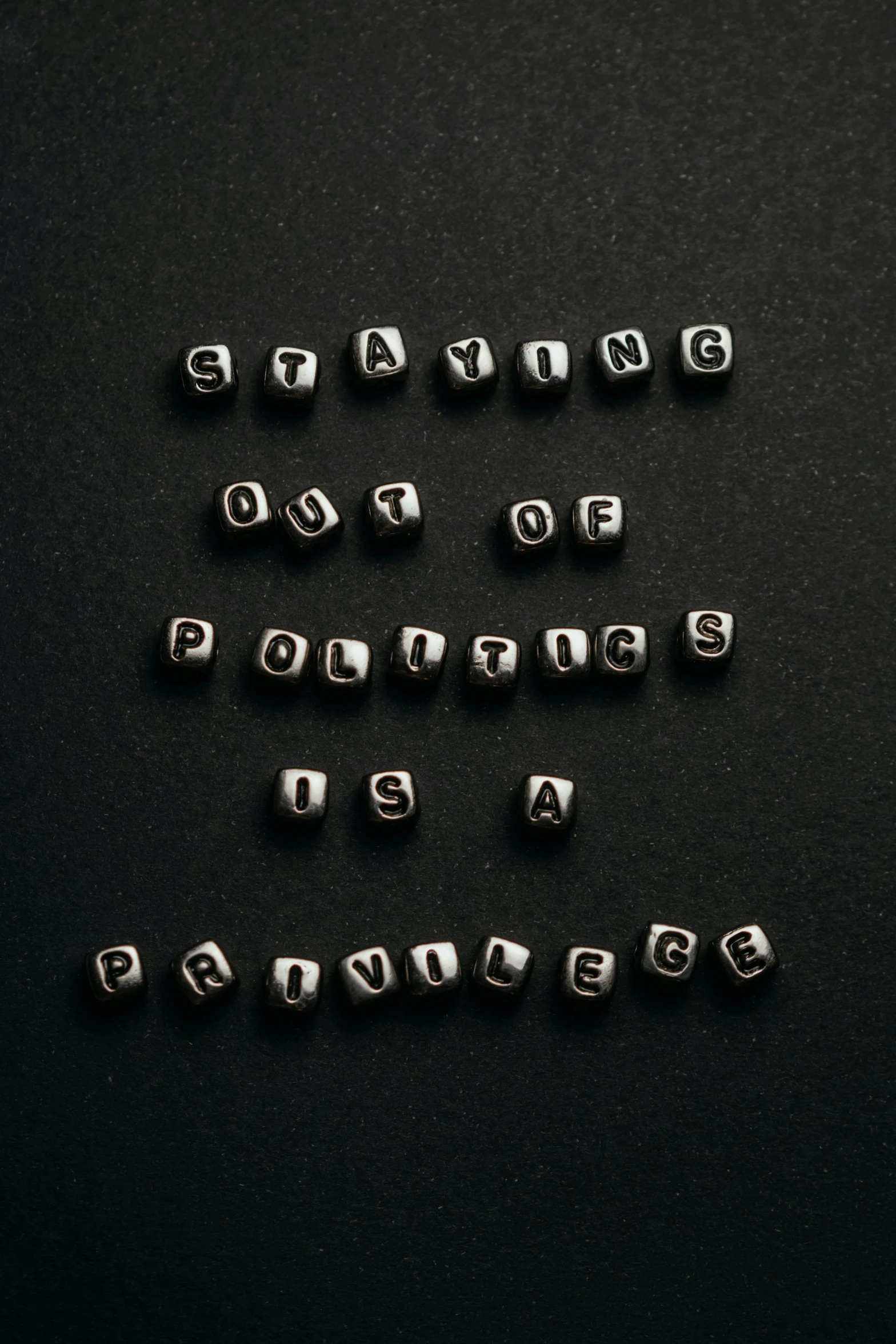 several silver letters that spell out words like q, p, d, e and f