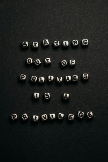 several silver letters that spell out words like q, p, d, e and f