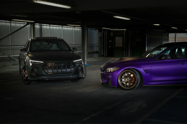 two cars in a darkened parking garage