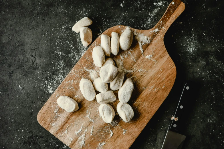 a  board with some small doughnuts on it