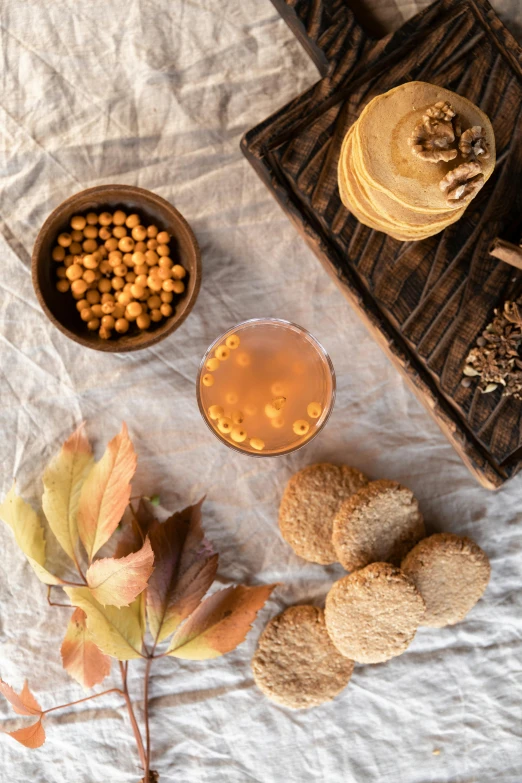 food and beverage laid out on top of an old wooden tray