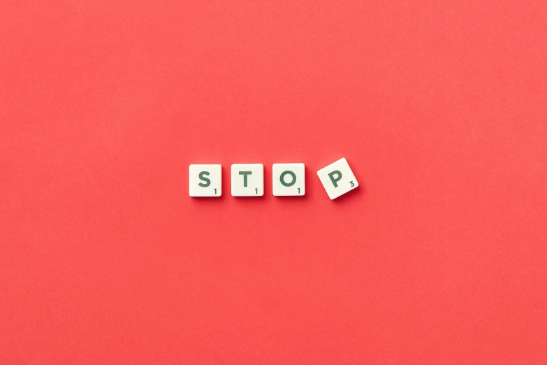 the word stop spelled with cubes and blocks