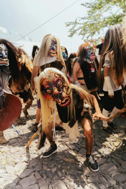 several colorful masks are being observed by many people