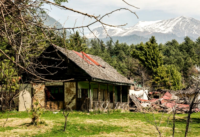 this old cabin is located near the mountains