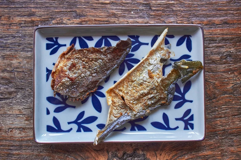 two pieces of food on a plate that is placed on a table