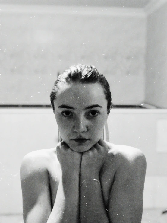 a woman is standing  in a shower