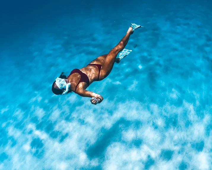 an aerial s of a person floating on the water