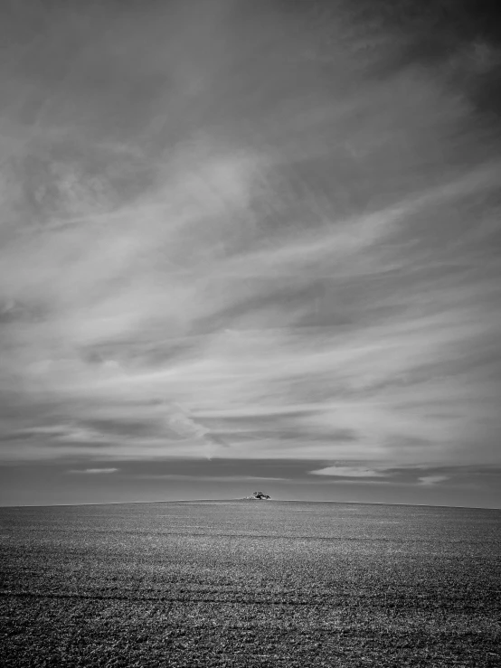 an empty beach with only two people in it