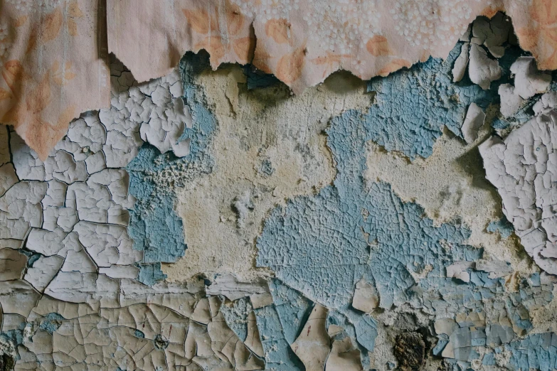 paint peeling and chipped off of an old wall