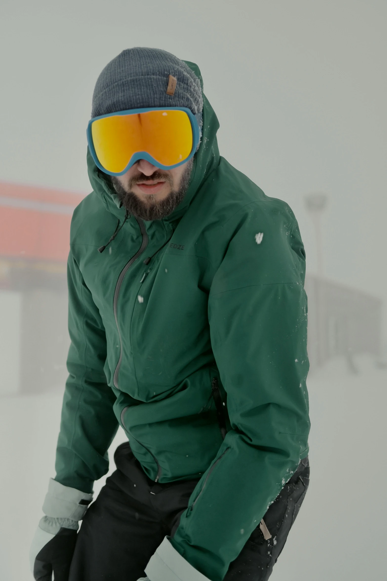 a man on skis stands in the snow