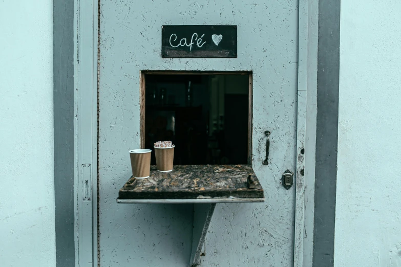 a coffee cup is sitting on a ledge