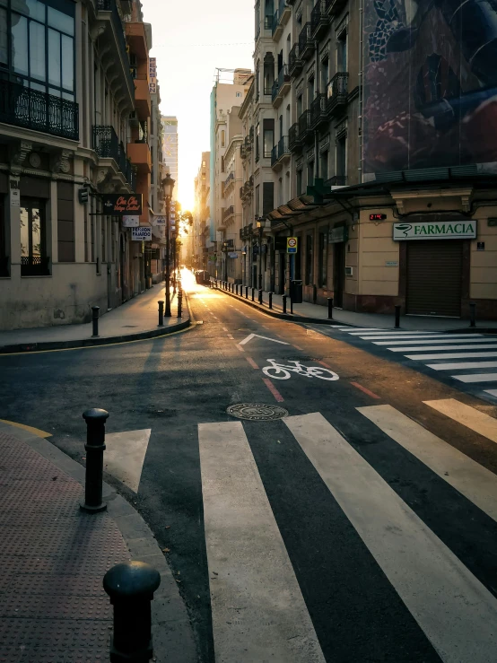 a city street with a person crossing the road