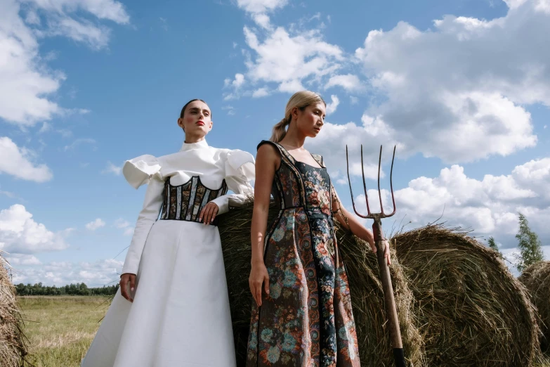 two women in medieval dress pose for the camera