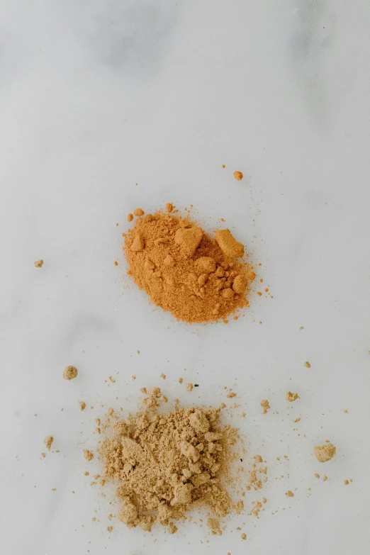 two brown powder pieces next to each other