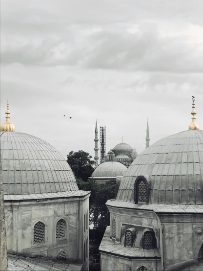 an old - fashioned picture of domes in a cloudy day